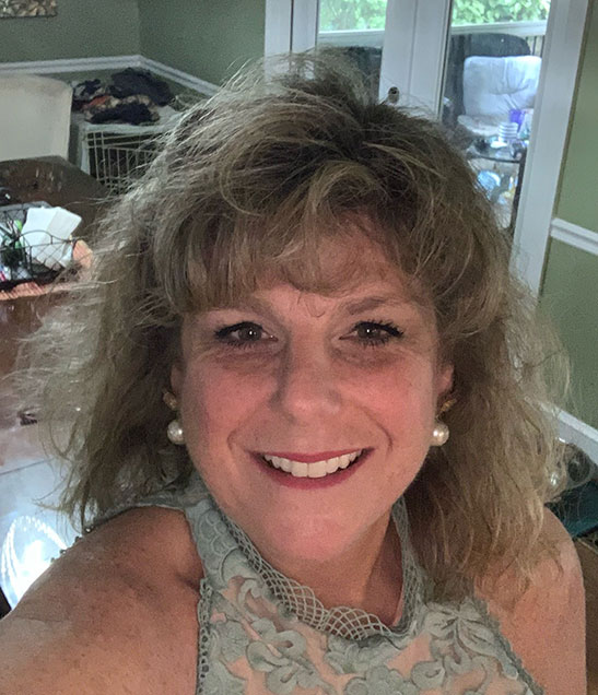 Gina Stavredes Profile Photograph